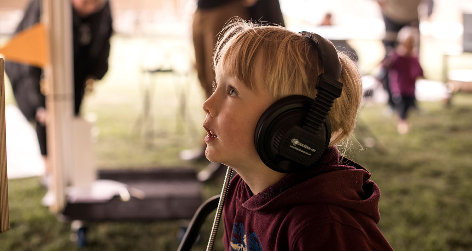 Visitor using MKII Headphones at the Auckland War Memorial Museum.2