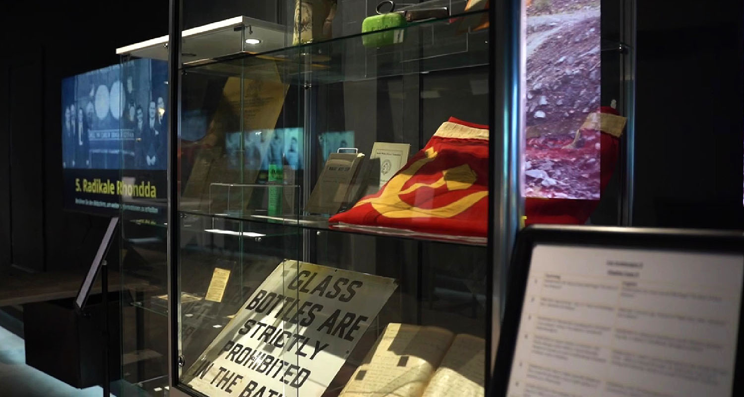 Exhibit surrounded by screens and touchscreens at Rhondda Heritage Park