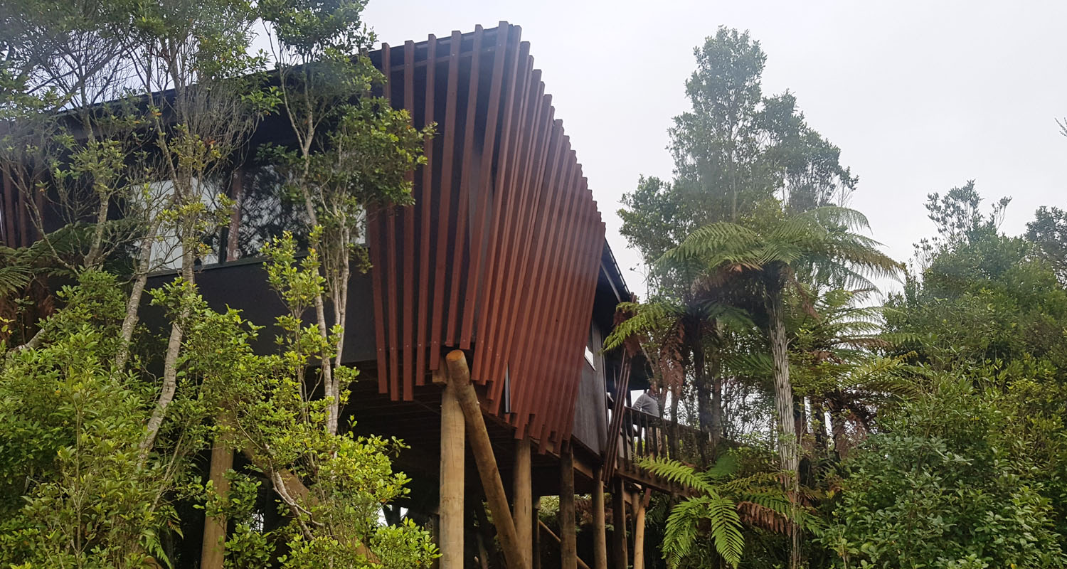 Piwakawaka Family Hut exterior at Pukeiti Rainforest