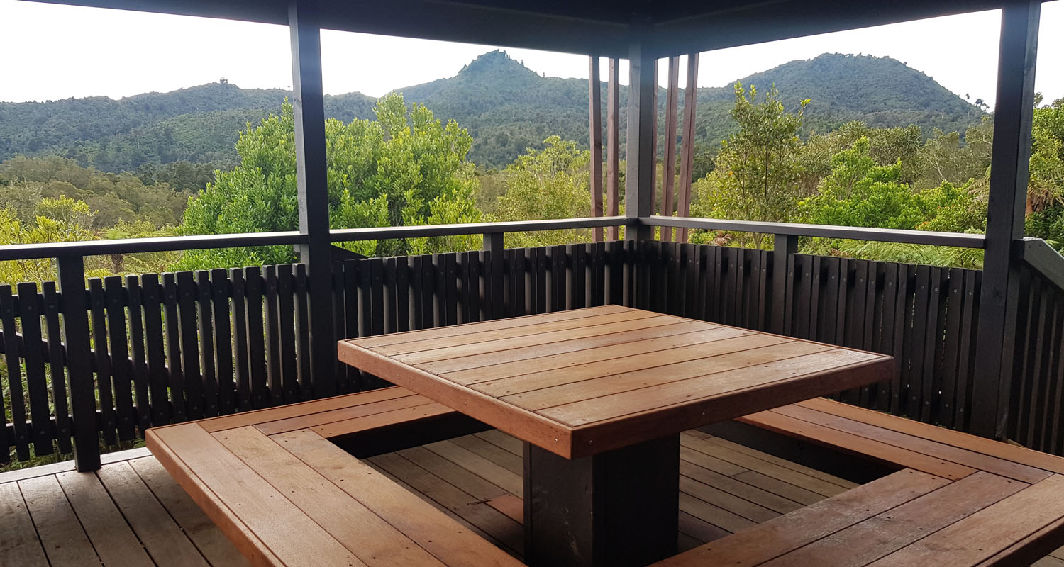 Piwakawaka Family Hut porch at Pukeiti Rainforest